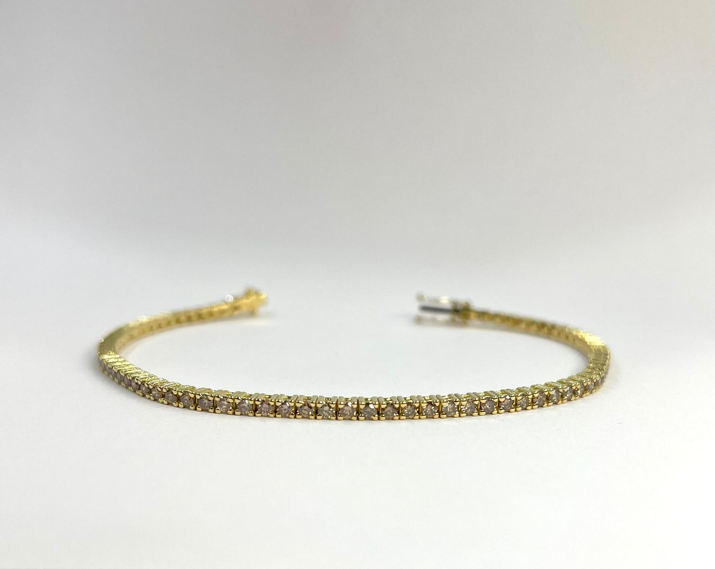 PULSERA DE TENIS DE ORO AMARILLO CON BROWNIES